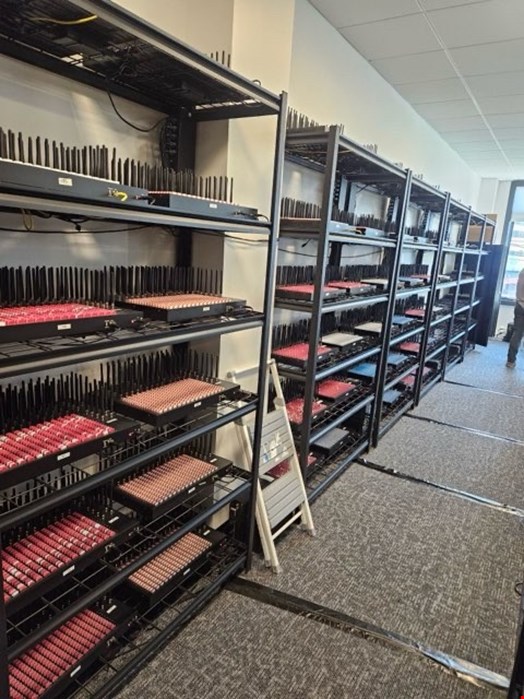Wall of SIM boxes. Source: US Secret Service
